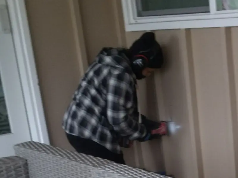 Professional electrician installing an exterior outlet in Oakbrook